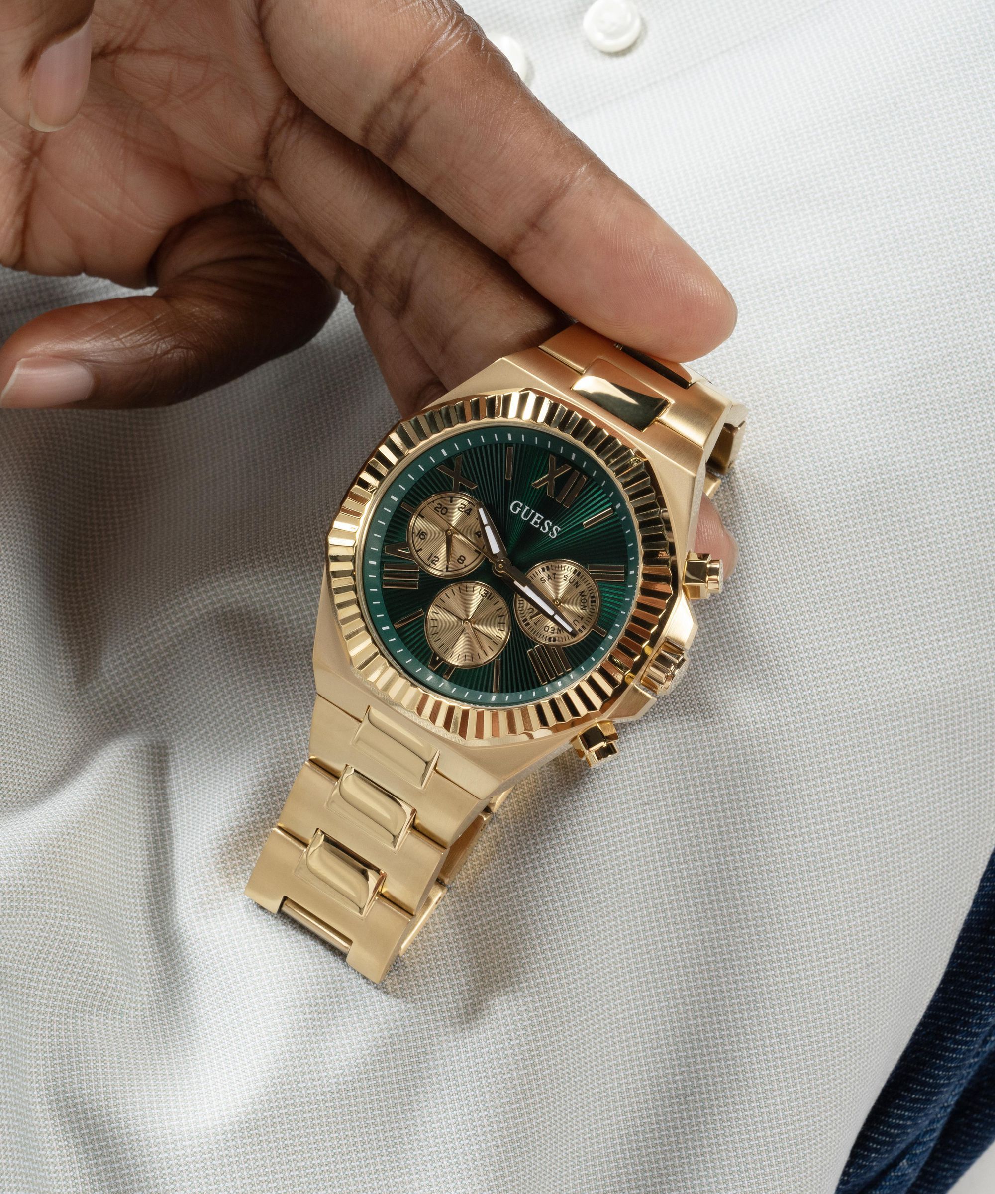 Guess gold tone multifunction watch top