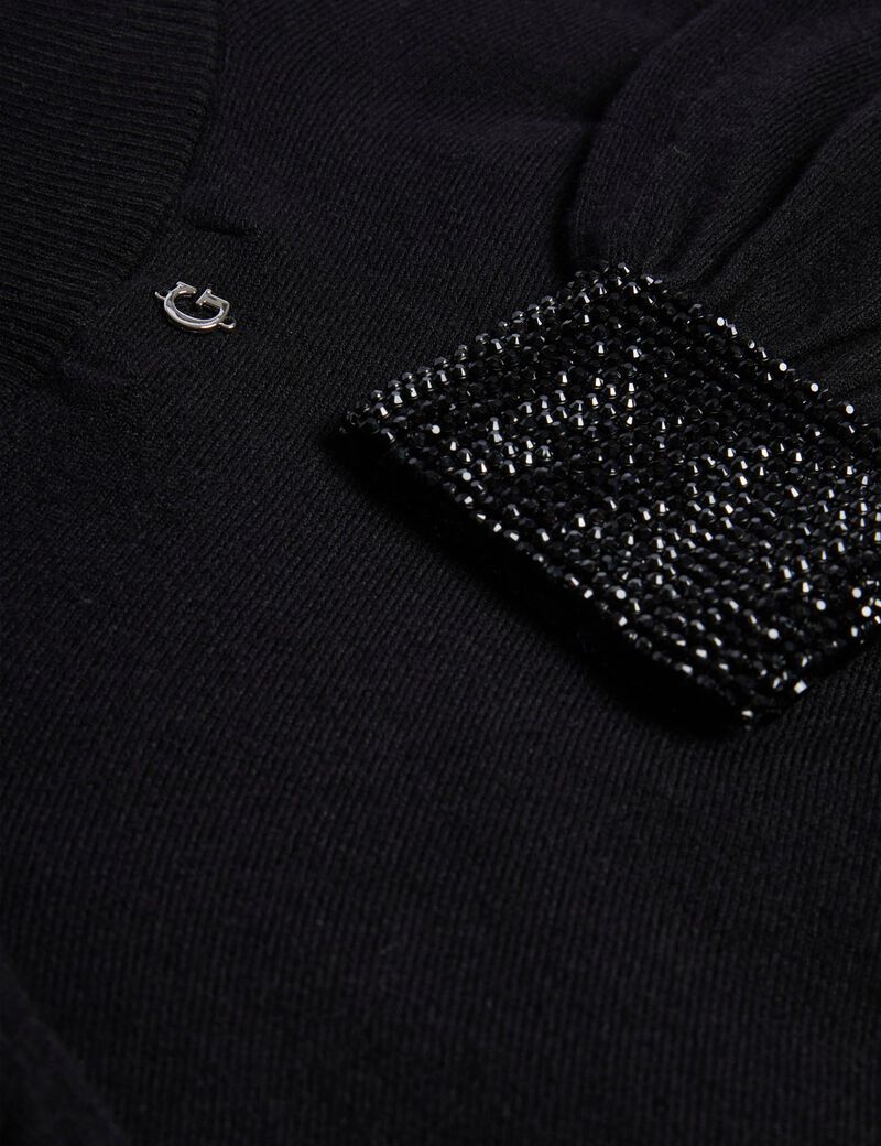 سترة بأكمام مرصعة بأحجار الراين