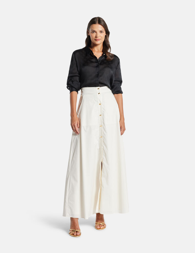 قميص بشعار 4G وزهرة الفاوانيا